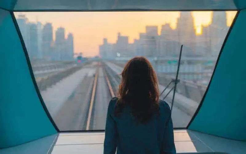 Woman Traveling in Metro sunset